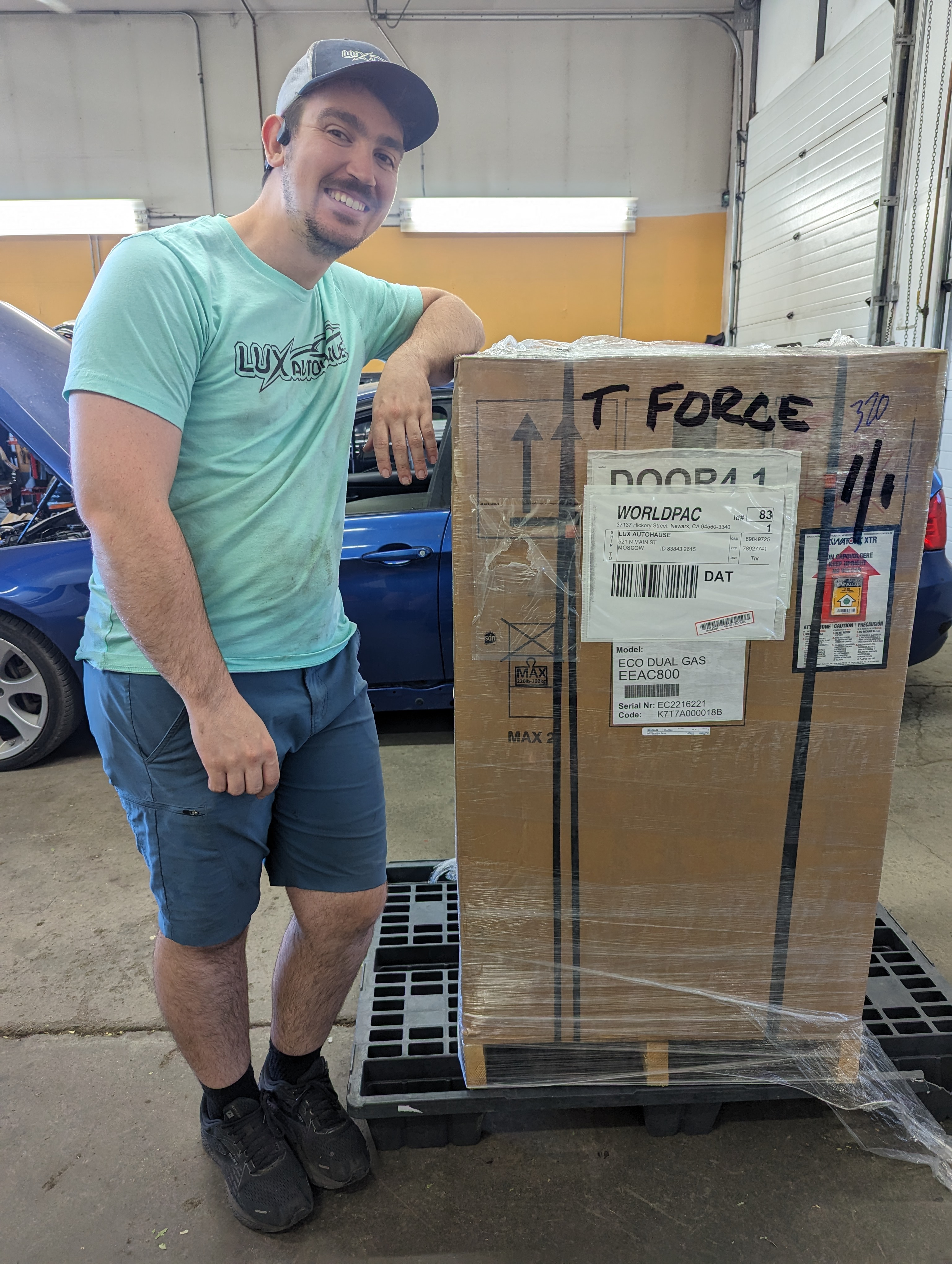 Ken Weaver, owner of Lux AutoHause, with a Worldpac parts delivery