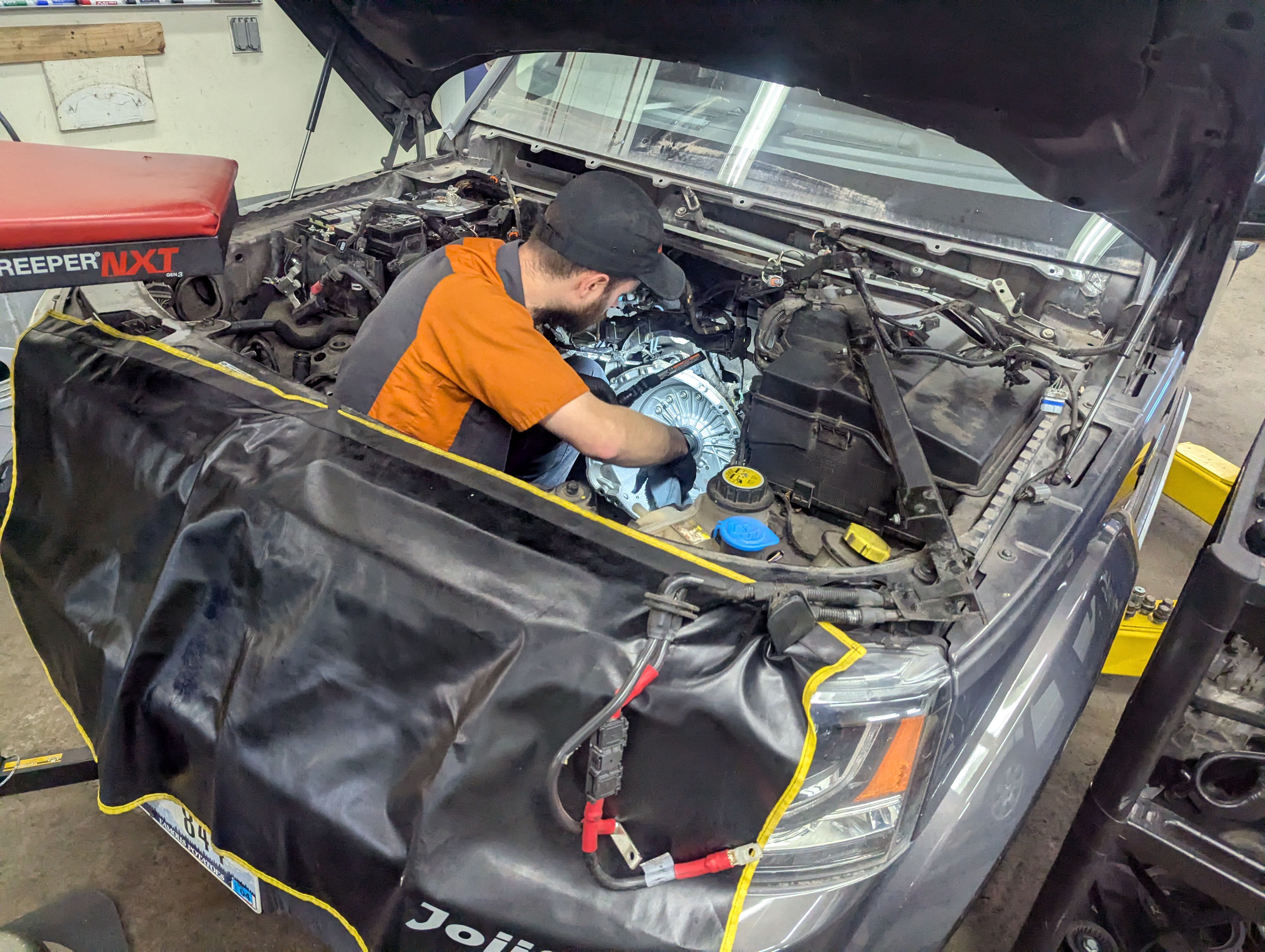 Technician performing LR4 engine work at Lux AutoHause