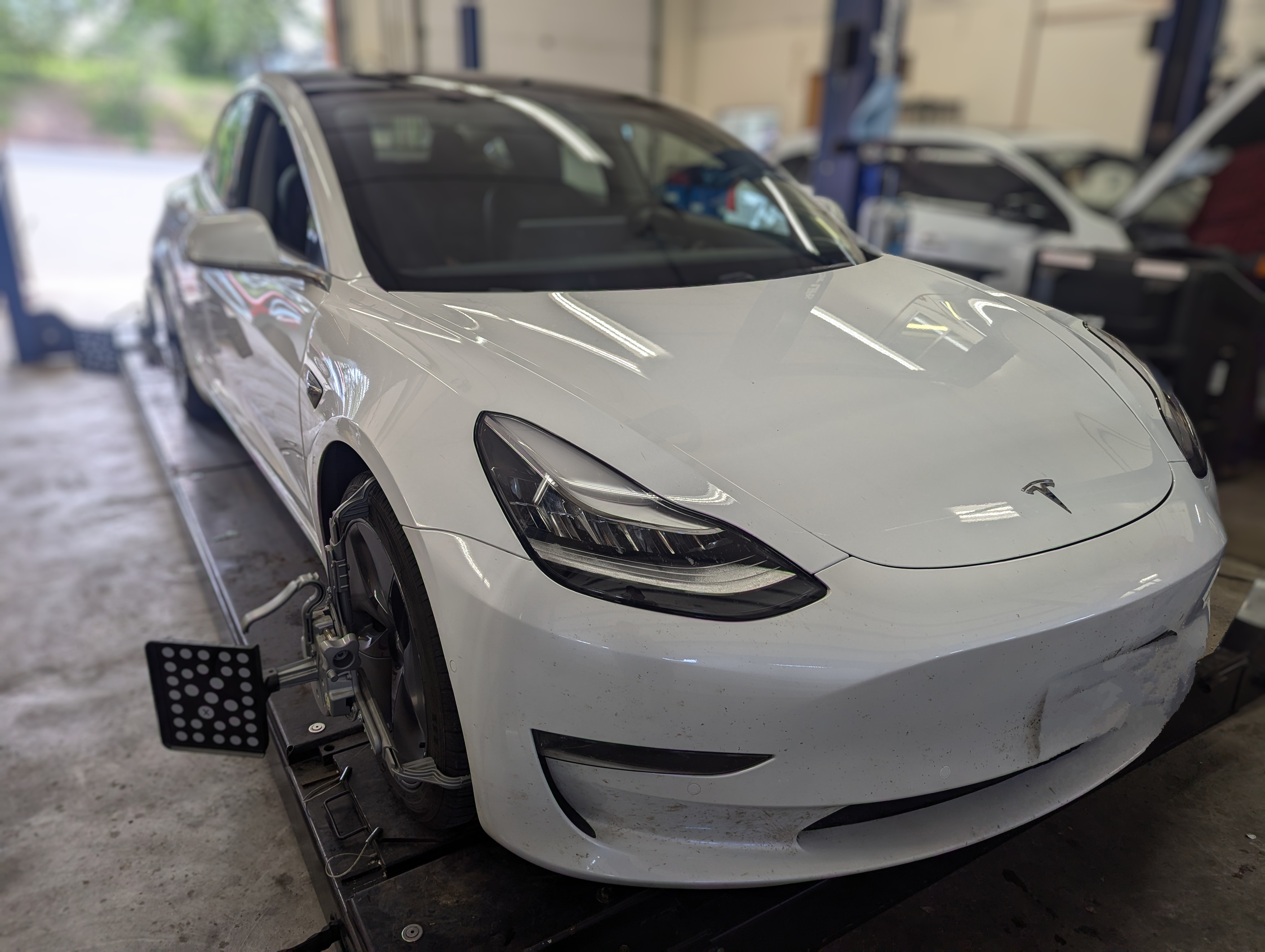 Tesla Model 3 on alignment rack at Lux AutoHause in Moscow Idaho